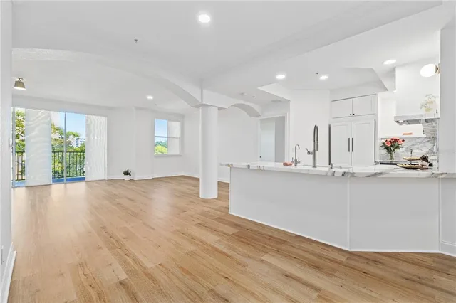 a view of kitchen with wooden floor and window