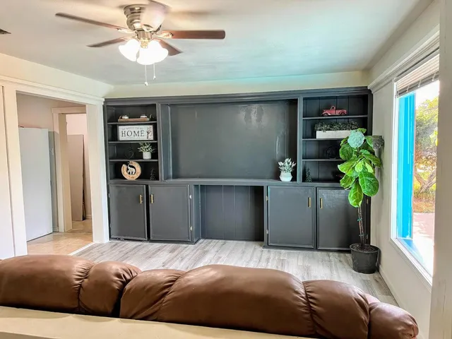 a bedroom with a bed and a potted plant