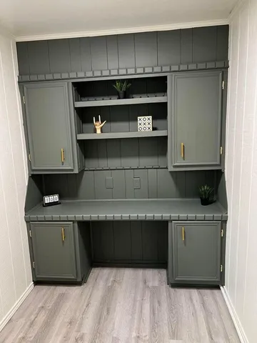 a kitchen with stainless steel appliances granite countertop a cabinets counter space and wooden floor