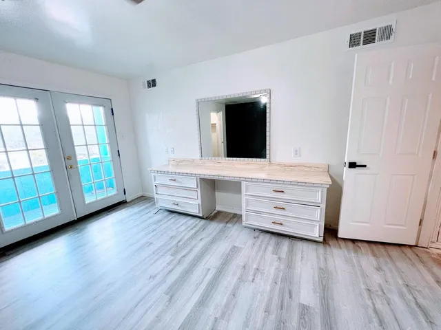 wooden floor and window in a room
