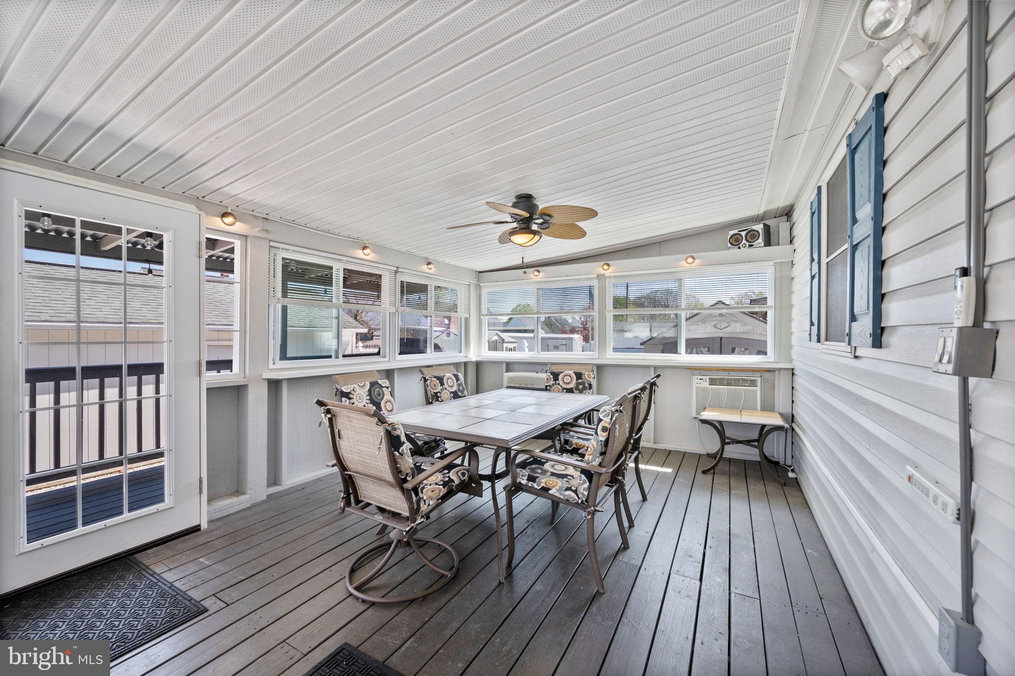 8626 Wise Avenue Baltimore, MD 21222 - Photo 37 of 57 a dining room with a wooden table and chairs