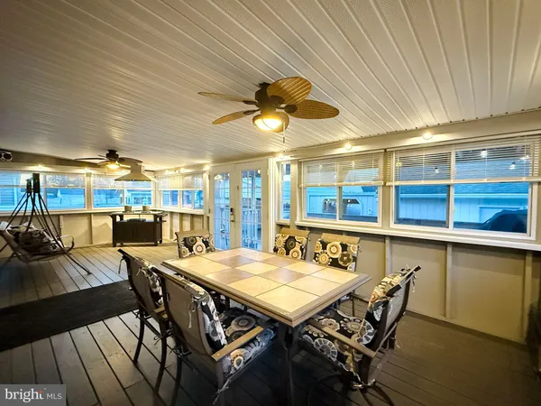 a view of a dining room with furniture and window