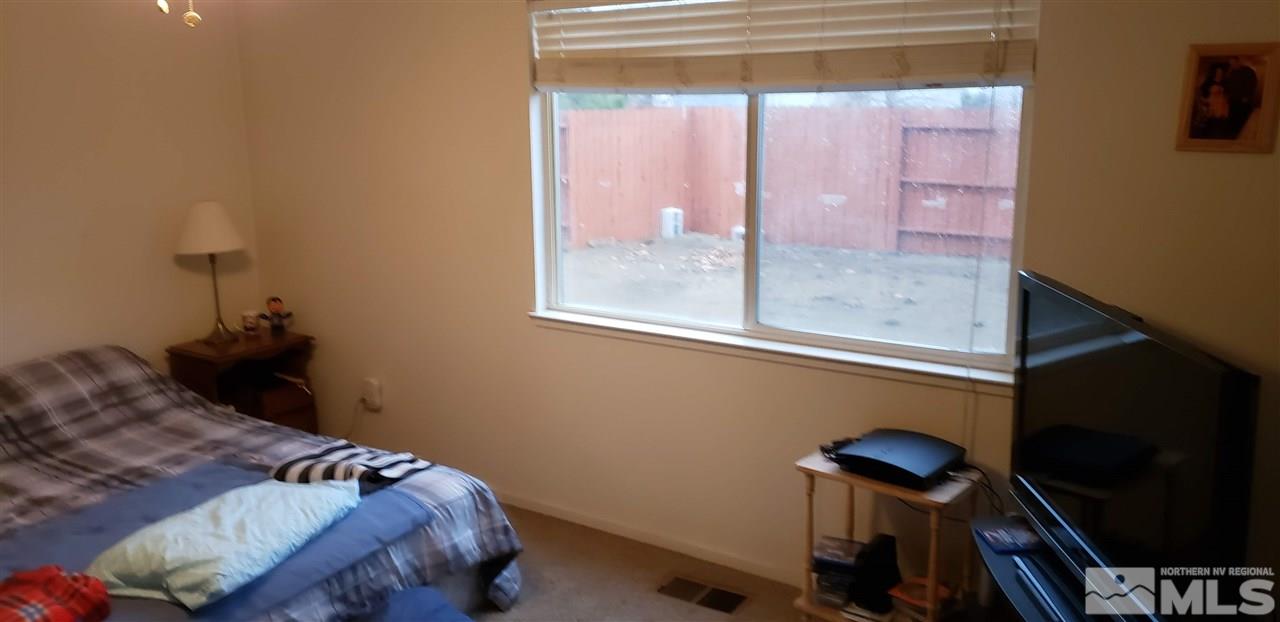 85 Calistoga Court Reno, NV 89508 - Photo 12 of 23 a bedroom with a bed and a window