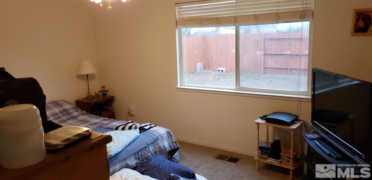 85 Calistoga Court Reno, NV 89508 - Photo 13 of 23 a bedroom with furniture and a window