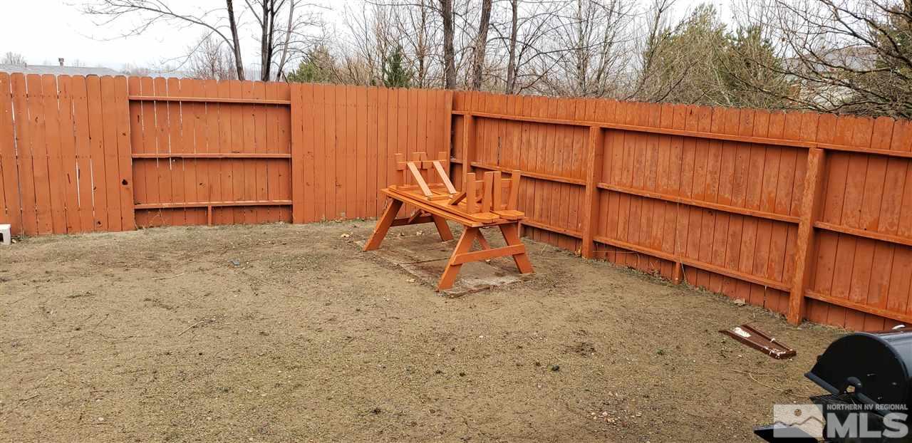 85 Calistoga Court Reno, NV 89508 - Photo 20 of 23 a backyard of a house with table and chairs