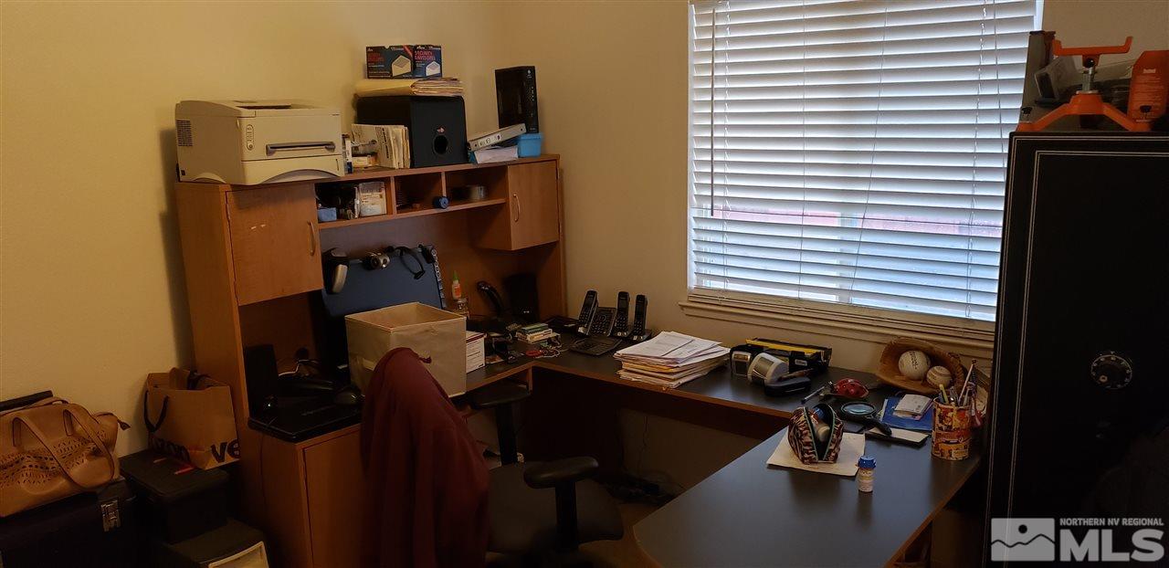 85 Calistoga Court Reno, NV 89508 - Photo 5 of 23 a view of a workspace with furniture and a window