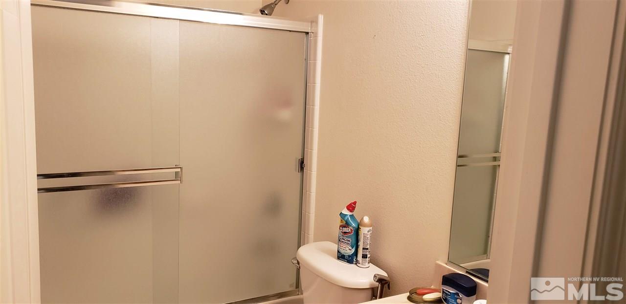 85 Calistoga Court Reno, NV 89508 - Photo 8 of 23 a bathroom with a shower and a toilet