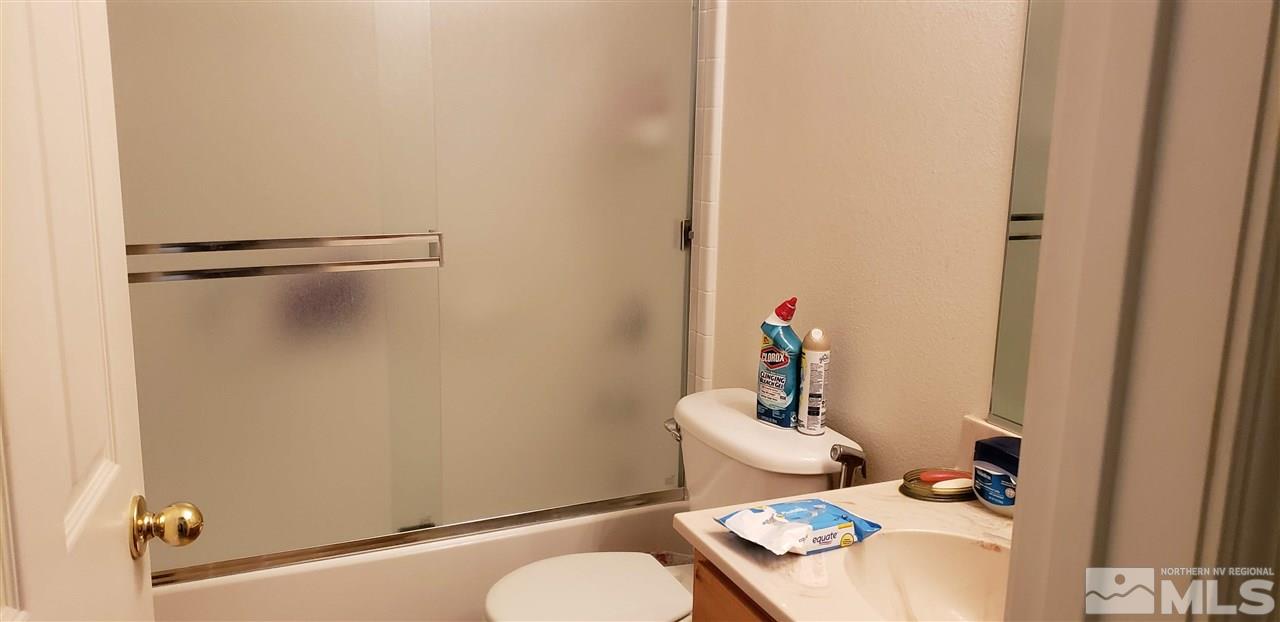 85 Calistoga Court Reno, NV 89508 - Photo 9 of 23 a bathroom with a sink toilet and shower