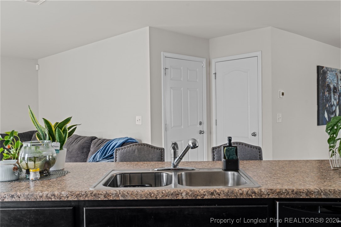 287 Hallow Oak Street Spring Lake, NC 28390 - Photo 16 of 37 a view of living room with granite countertop couches with wooden floor