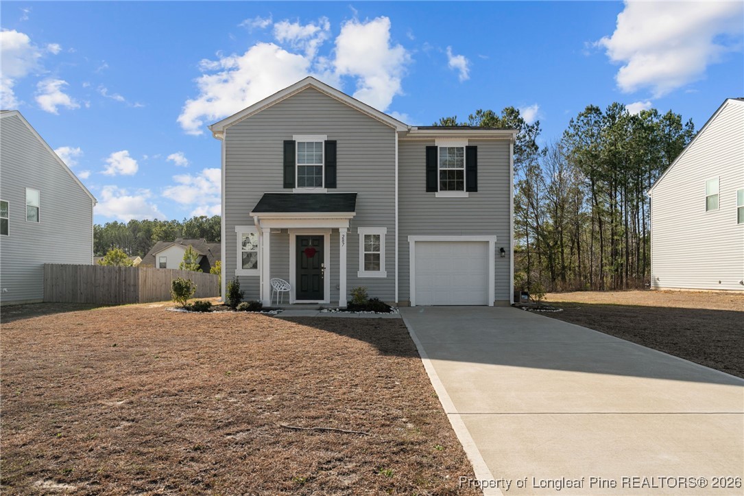 287 Hallow Oak Street Spring Lake, NC 28390 - Photo 2 of 37 a front view of a house with yard