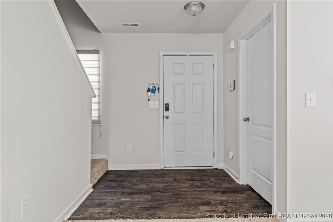 287 Hallow Oak Street Spring Lake, NC 28390 - Photo 23 of 37 a view of an empty room with wooden floor