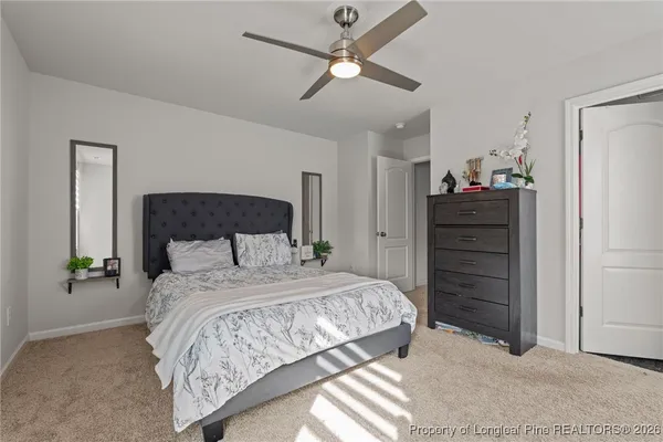 a bedroom with a bed and a dresser