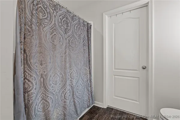 a bathroom with a toilet and shower