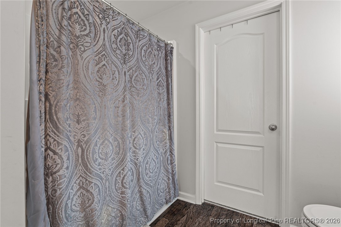 287 Hallow Oak Street Spring Lake, NC 28390 - Photo 27 of 37 a bathroom with a toilet and shower