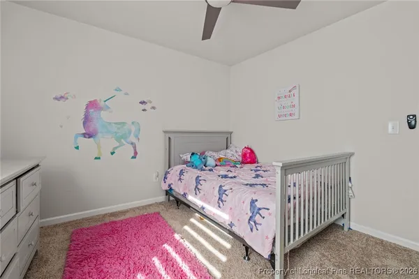 a bedroom with a bed and dresser