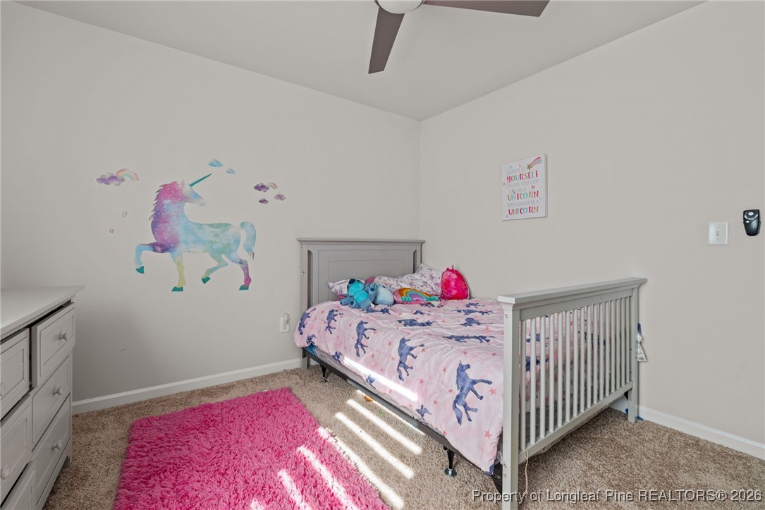 287 Hallow Oak Street Spring Lake, NC 28390 - Photo 29 of 37 a bedroom with a bed and dresser