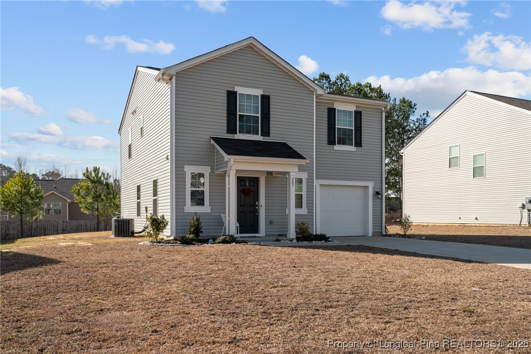 287 Hallow Oak Street Spring Lake, NC 28390 - Photo 3 of 37 a front view of a house with a yard