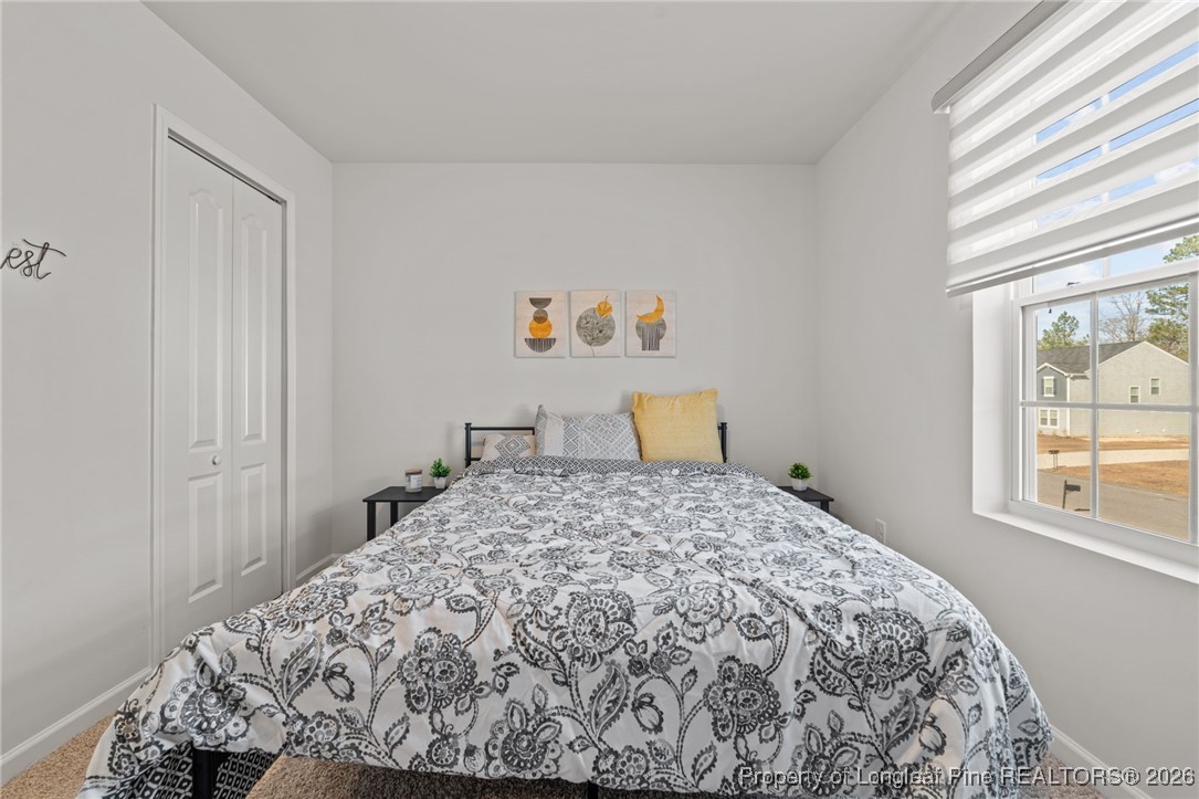 287 Hallow Oak Street Spring Lake, NC 28390 - Photo 33 of 37 a bedroom with a bed and a window