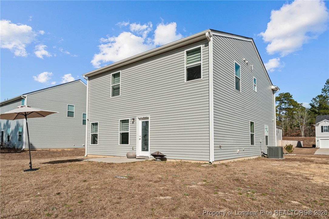 287 Hallow Oak Street Spring Lake, NC 28390 - Photo 34 of 37 a view of a house with a yard and garage