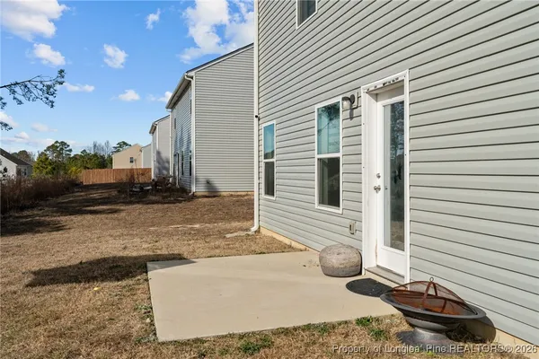 a view of a house with a yard and garage