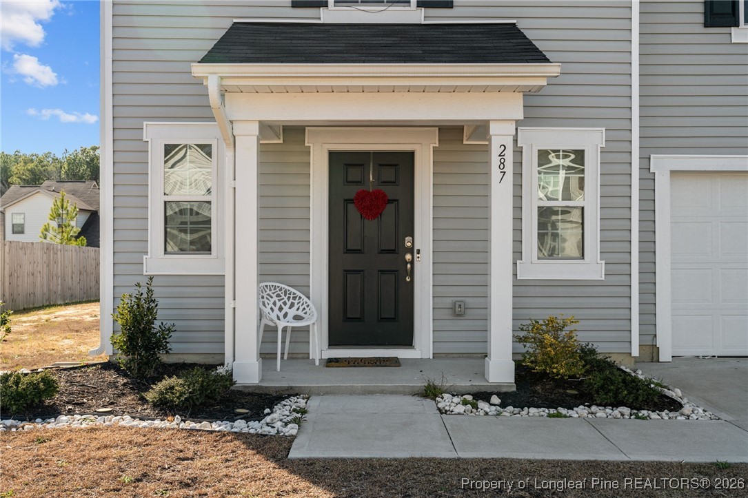 287 Hallow Oak Street Spring Lake, NC 28390 - Photo 6 of 37 a front view of a house with a yard