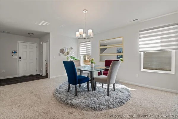 a view of a dining room with furniture