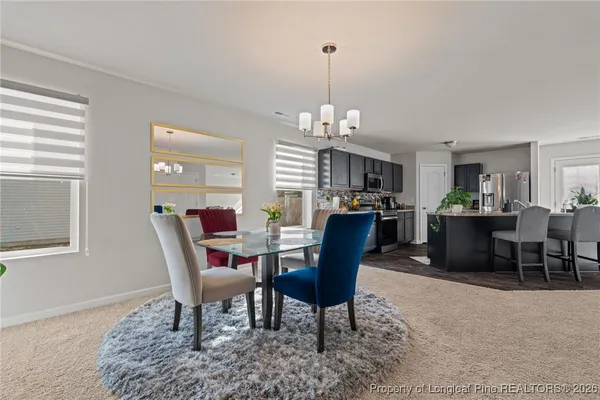 a view of a dining room with furniture