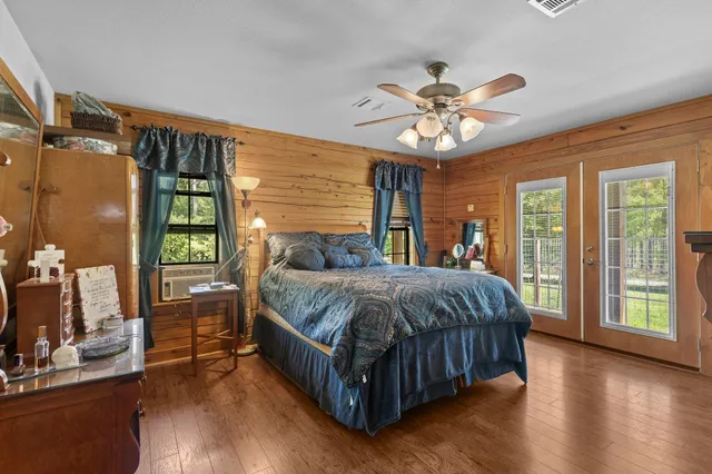 a spacious bathroom with a double vanity sink mirror and next to a window