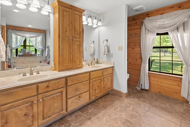 a bathroom with a bathtub and a shower