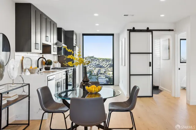 a bedroom with a bed and a large mirror