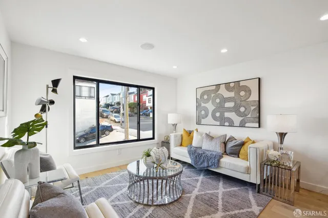 a view of a room with a table and chairs