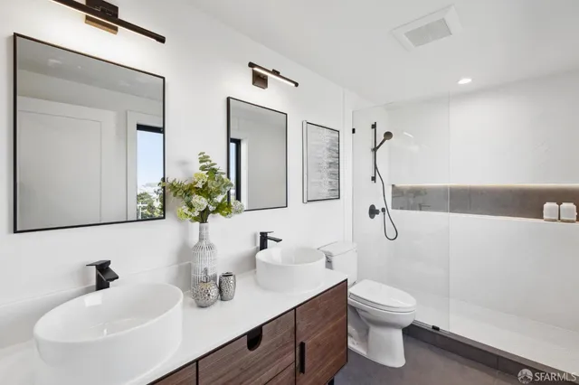 a bathroom with a shower and a mirror