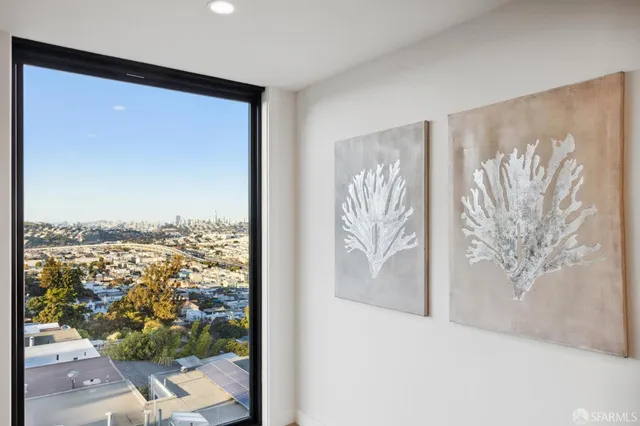 a kitchen that has a lot of cabinets and stainless steel appliances