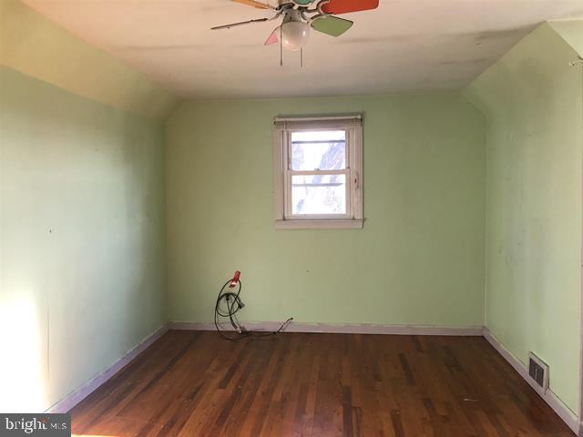 472 Richards Road Bridgeton, NJ 08302 - Photo 14 of 21 an empty room with wooden floor and chandelier fan