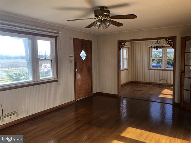 472 Richards Road Bridgeton, NJ 08302 - Photo 9 of 21 a view of an empty room with window and wooden floor