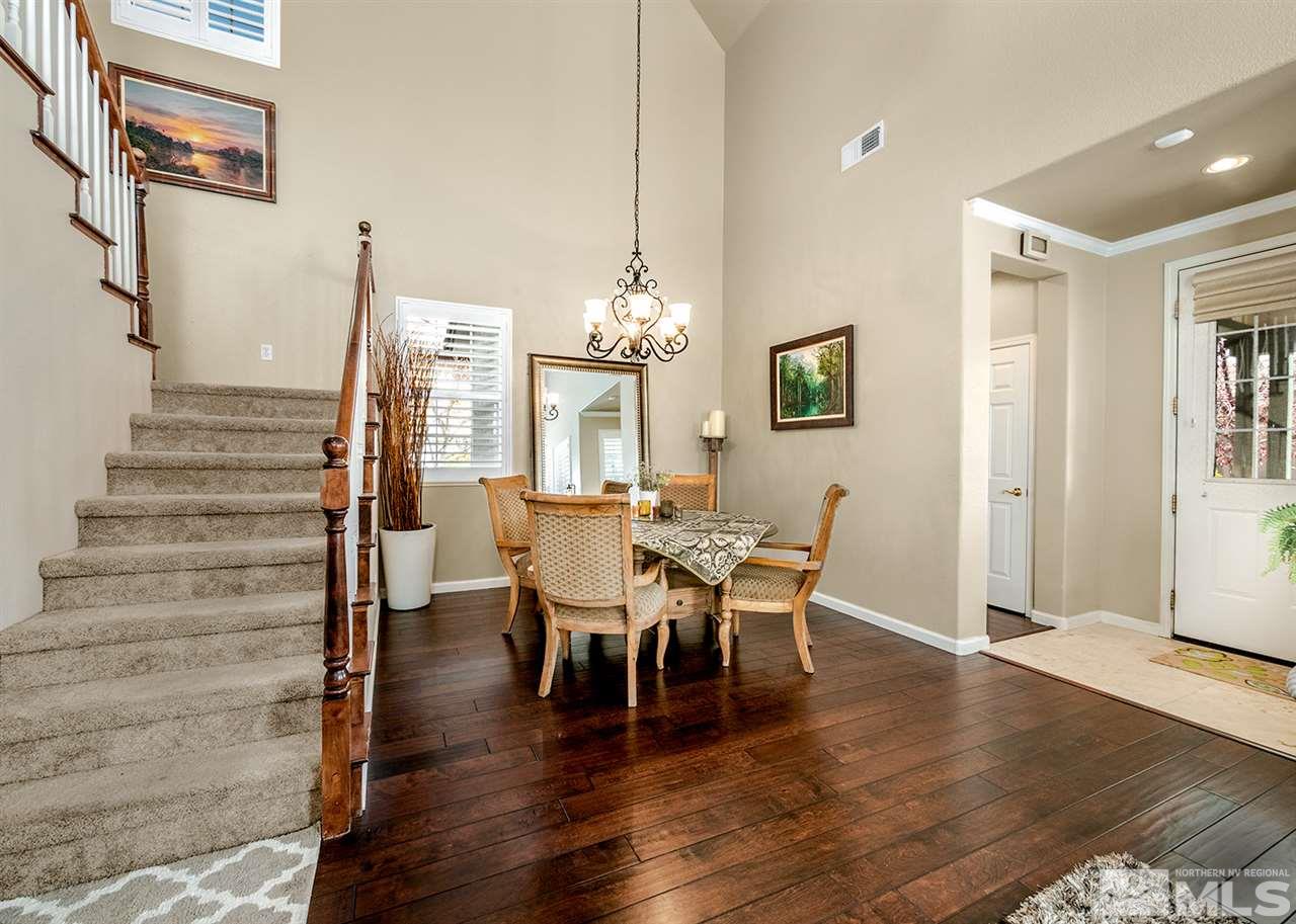 10535 Crystal Bay Drive Reno, NV 89521 - Photo 3 of 22 a view of a dining room with furniture and wooden floor