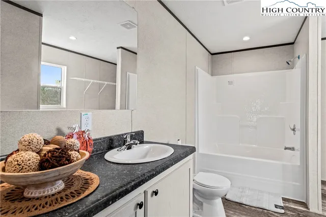 a view of a hallway to a bedroom