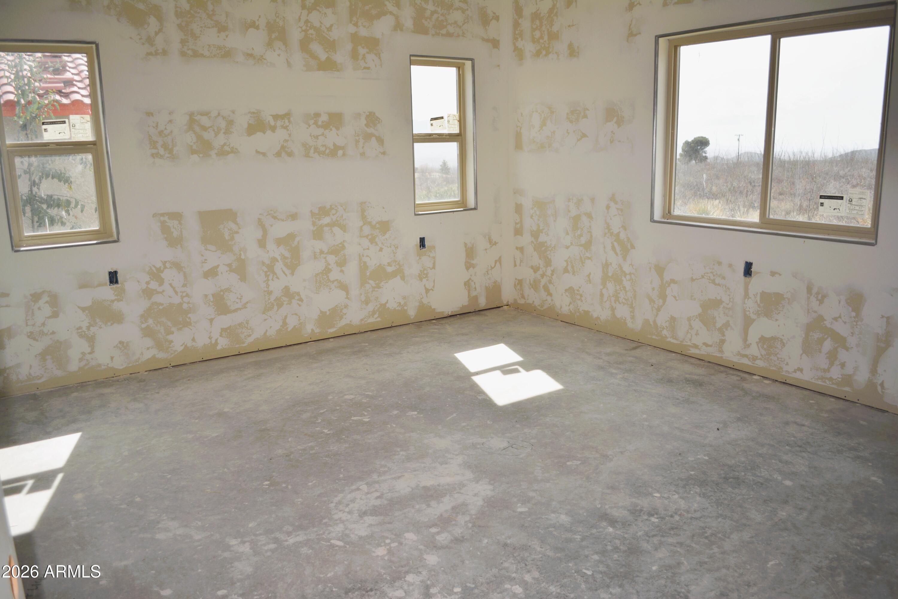 994 South Coy Street Bisbee, AZ 85603 - Photo 19 of 39 an empty room with windows and yard
