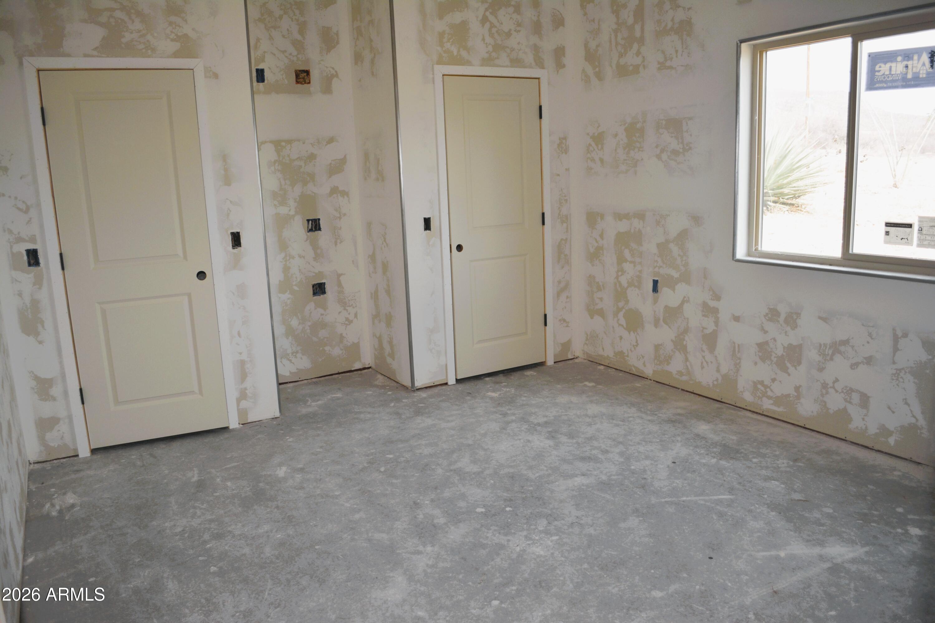 994 South Coy Street Bisbee, AZ 85603 - Photo 23 of 39 an empty room with windows and closet