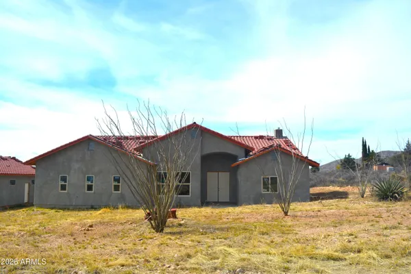 a house with yard in front of it