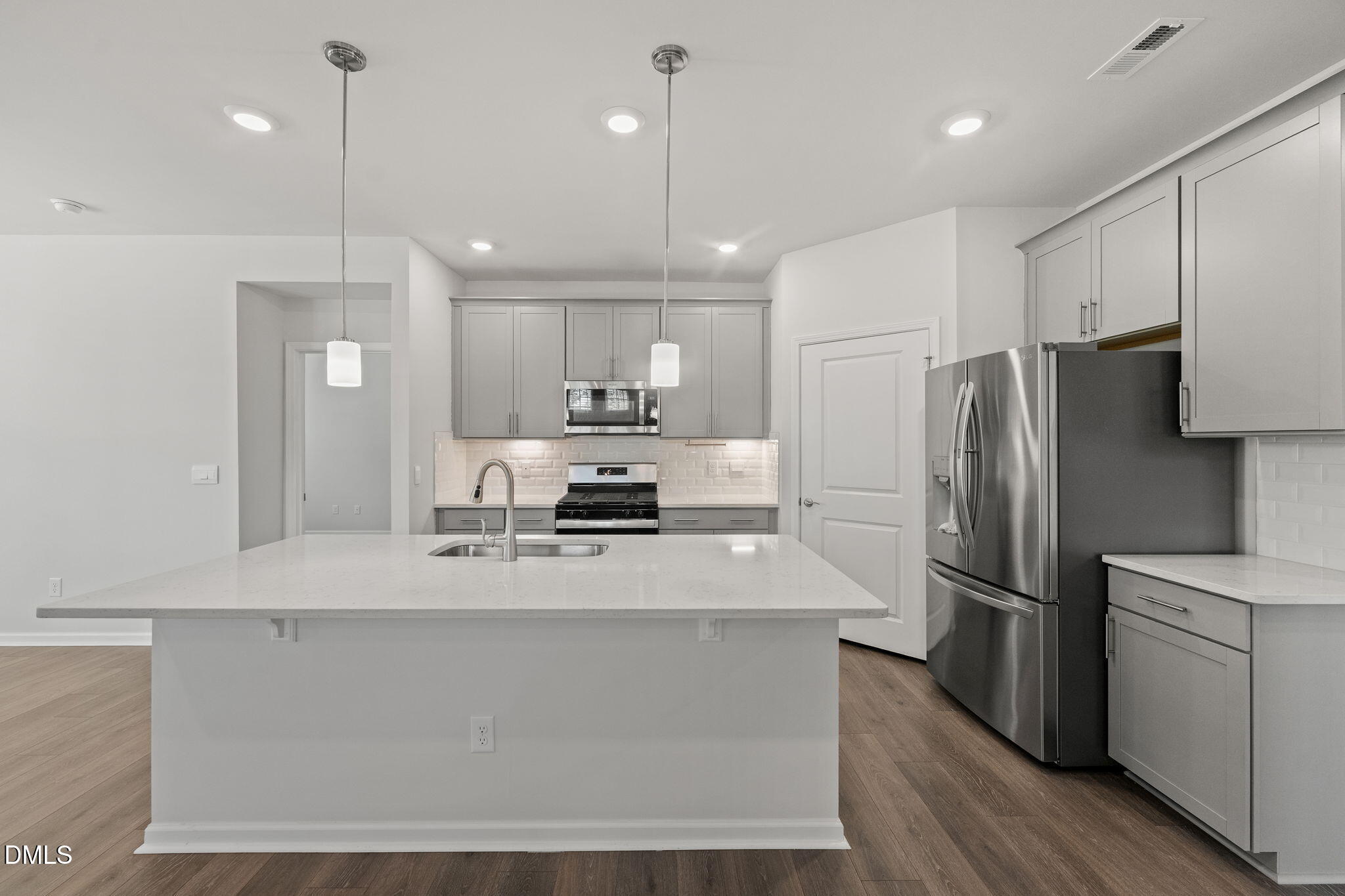 1639 Abberly Place Graham, NC 27253 - Photo 10 of 43 a kitchen with stainless steel appliances a refrigerator sink and microwave