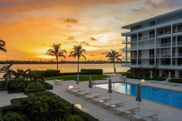 a view of a lake with a terrace with seating space