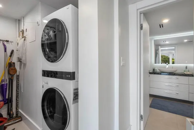 a view of a hallway with washer and dryer
