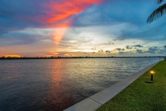 a view of swimming pool with outdoor seating