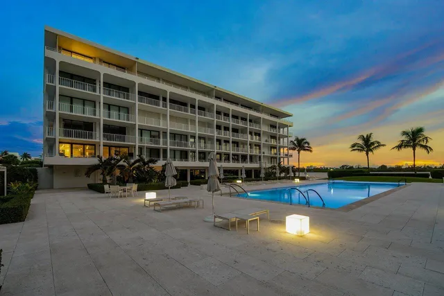 a view of a swimming pool with outdoor space and seating area