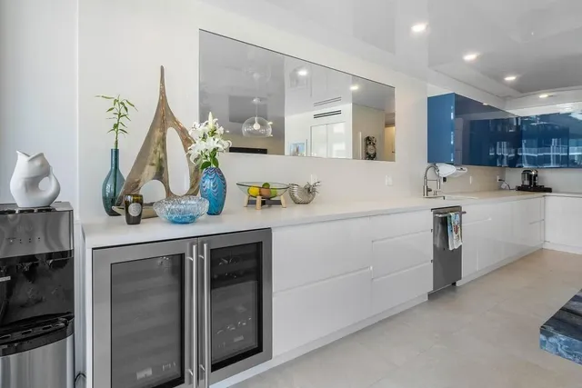a kitchen with a sink and cabinets