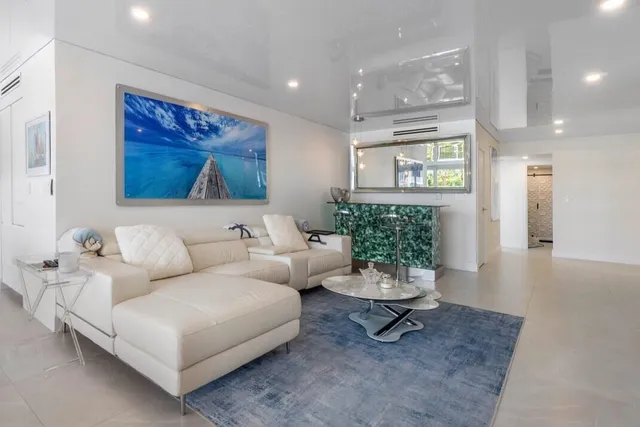 a living room with furniture and a painting