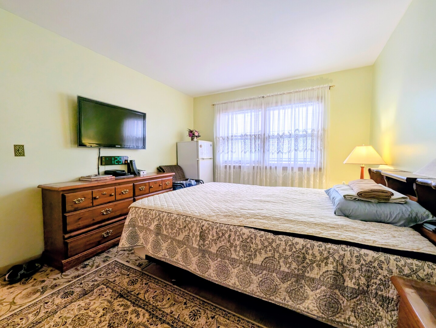 4229 North Keystone Avenue, Unit 3H Chicago, IL 60641 - Photo 17 of 22 a bedroom with a bed and flat screen tv