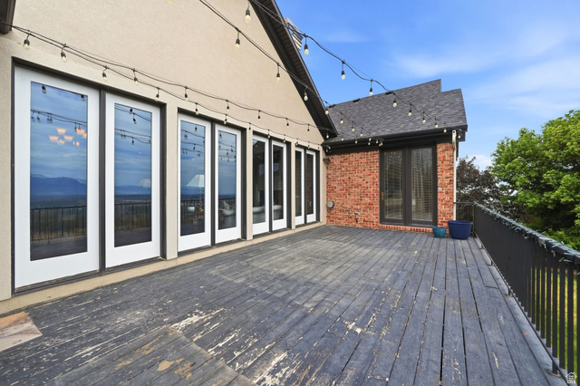 767 Draper View Road Draper, UT 84020 - Photo 61 of 71 Expansive exterior deck featuring a dark wood finish and black metal railing