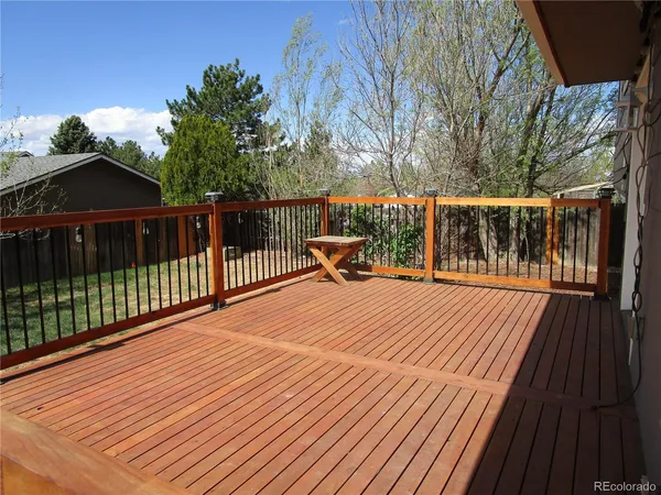 a balcony with trees in front of it